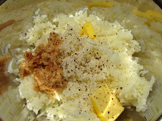 mixing garlic mashed potatoes