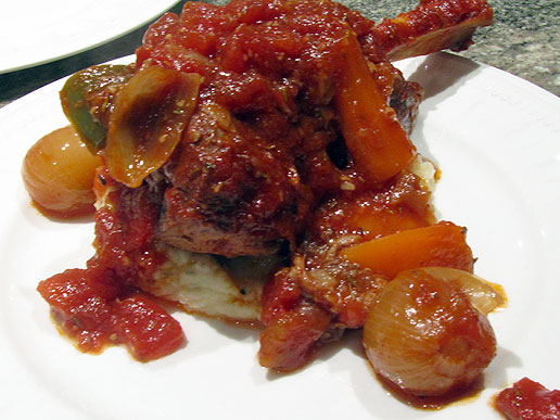 slow cooked lamb shanks served on garlic mashed potatoes
