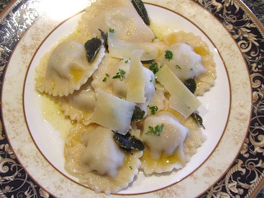 pumpkin ravioli with pine nuts with burnt sage butter