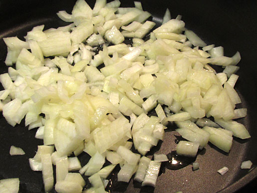 onions frying in a skillet